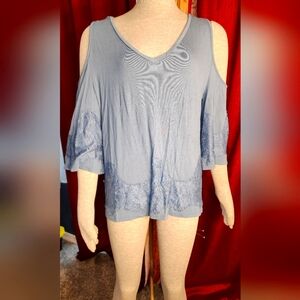 Blouse light blue in color open shoulders